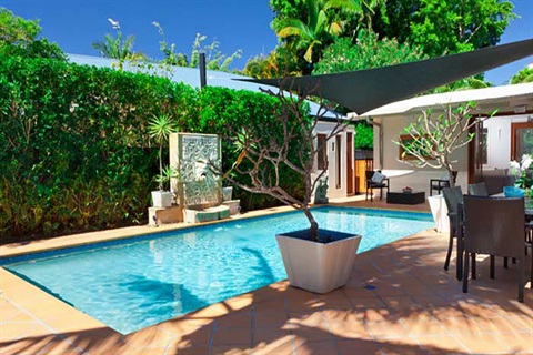 A photo of a backyard swimming pool.